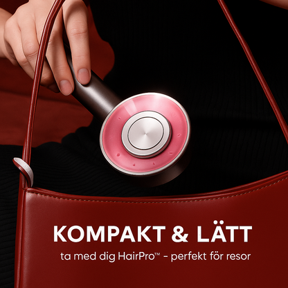 HairPro massagekam hålls i handen