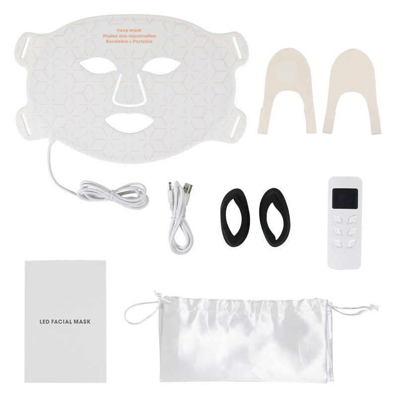 Vitt paket med mask, kablar och tillbehör